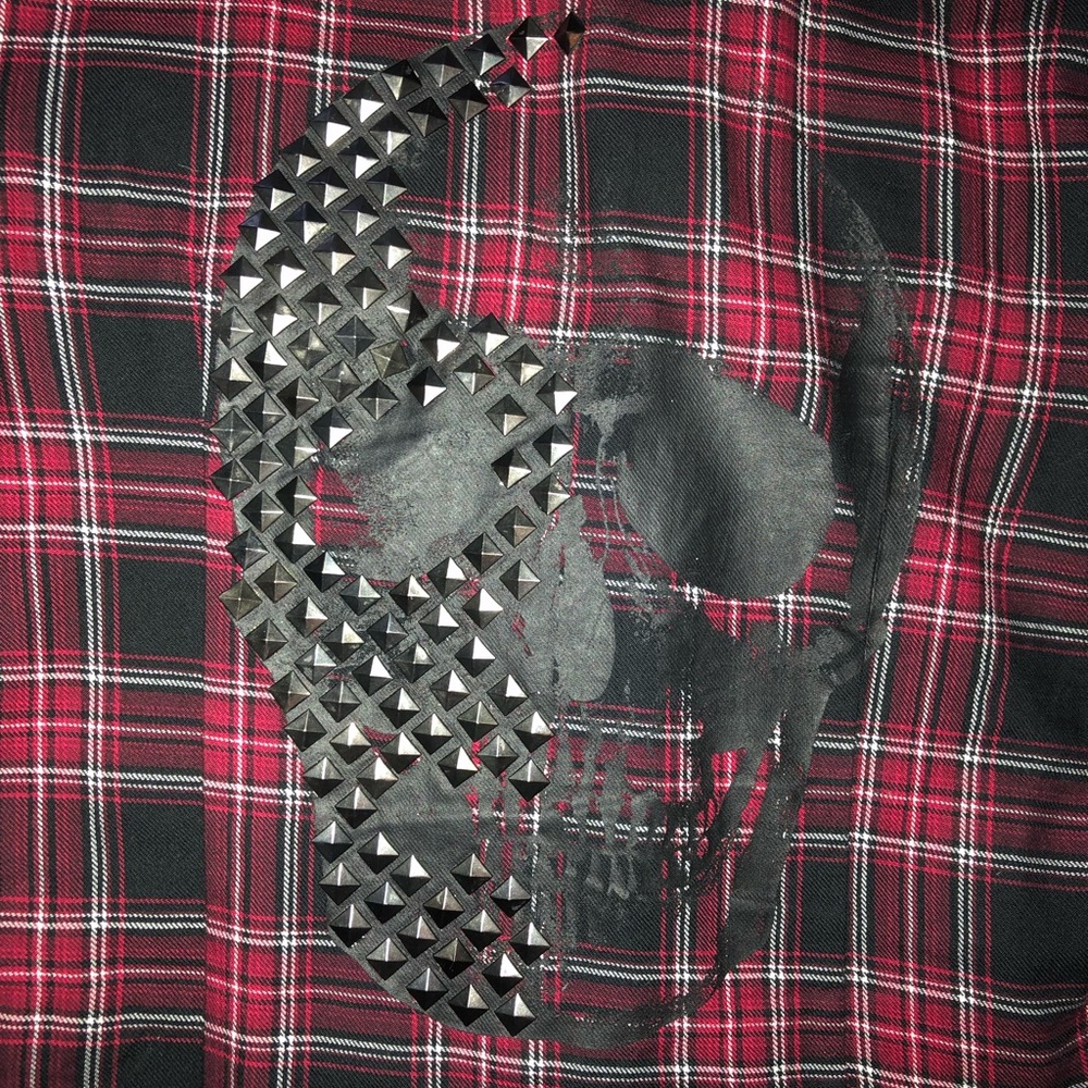 Hot topic flannel with studded skull on back